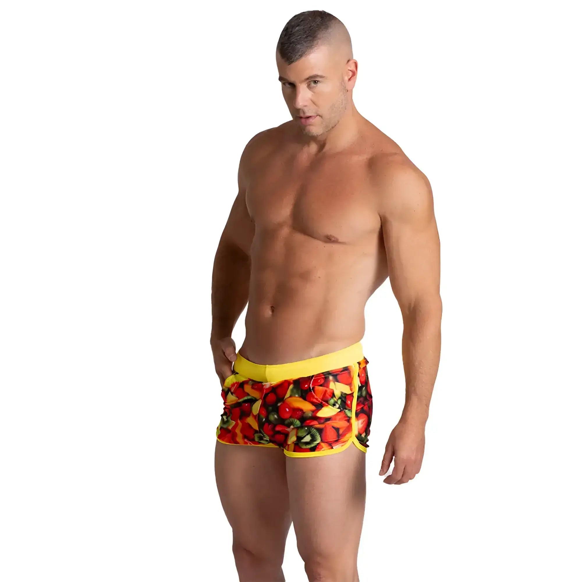 Bright yellow Gigo Salad Beachwear swim trunks with vibrant colorful fruit and vegetable print for beachwear use