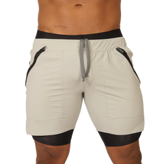 Cream-colored Gigo sporty gray short with black trim, side zippers, and drawstring waistband for athletic use