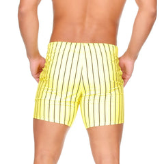 Bright yellow swim trunks with bold black vertical stripes from gigo sultan yellow beachwear collection