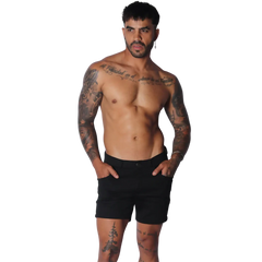Form-fitting black short-length casual shorts with a flat front, button closure, and side pockets.