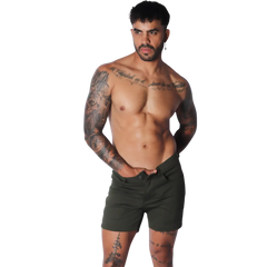 Slim-fit forest green cotton shorts featuring a mid-thigh length, button fly, and classic five-pocket design.