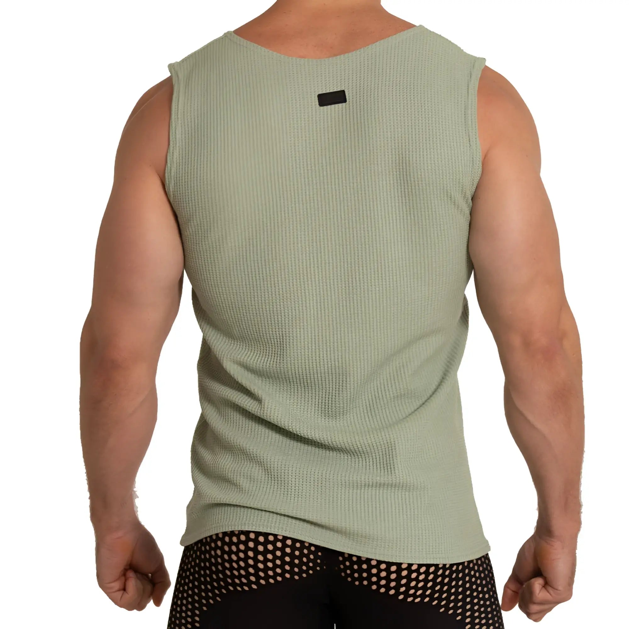 Menâ€™s olive green ribbed sleeveless tank top with black neckline tag called Gigo Tissue Green Tank