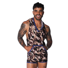 Sleeveless camo-print hooded shirt with a front kangaroo pocket and blue trim detail on a smiling tattooed man.