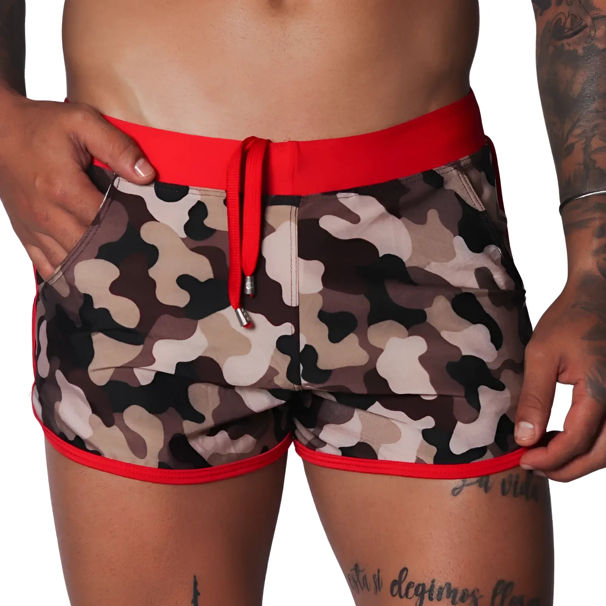 Men's camo beach shorts with red trim, drawstring waistband, and side pockets in a short athletic fit.