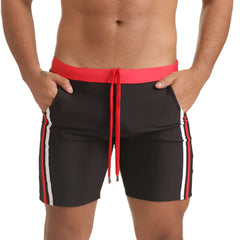 Gigo Versatil red beachwear black swim trunks with vibrant red waistband drawstring and bold white side stripes