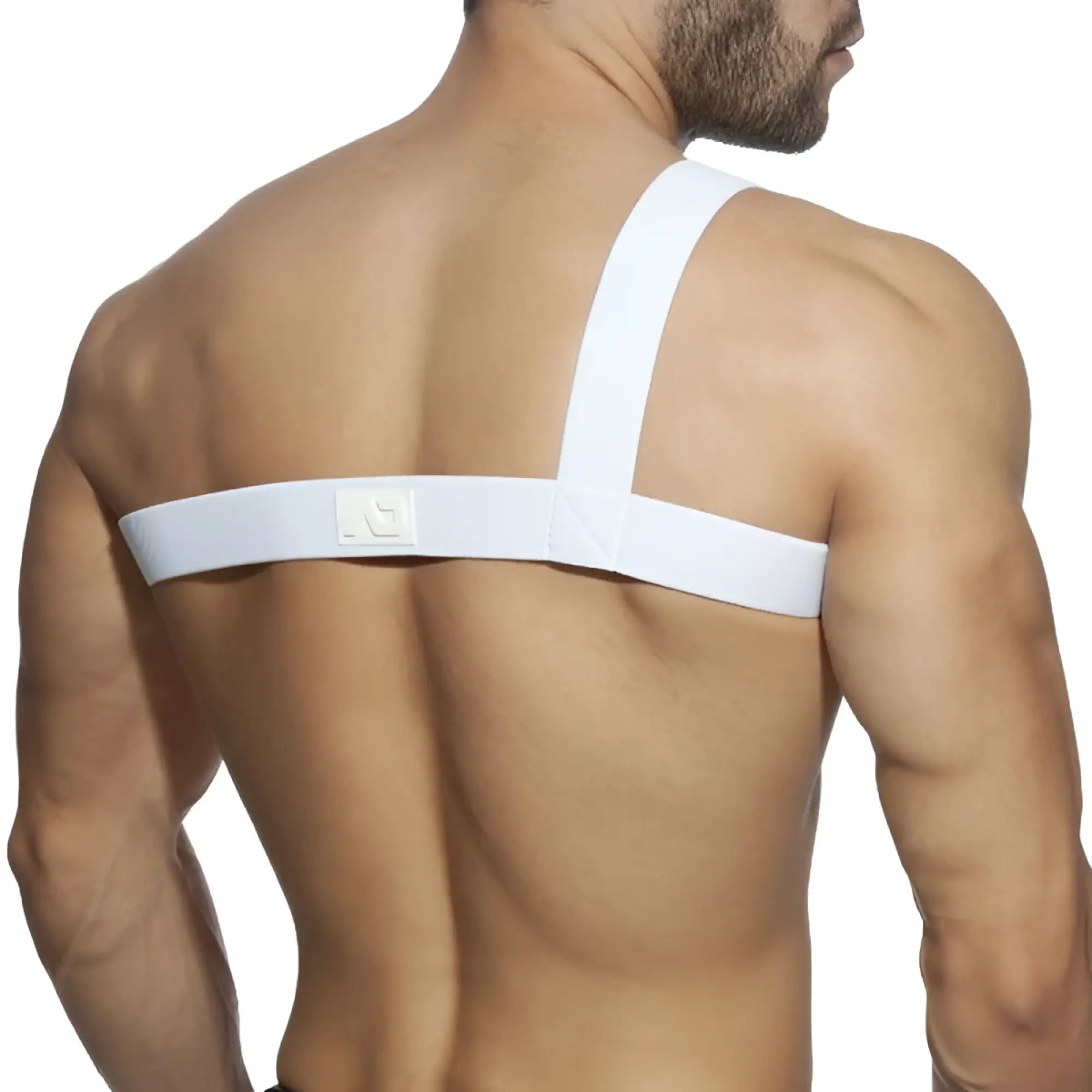 Back view of white gladiator clip harness with elastic strap and subtle textured weave featuring a small logo patch