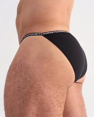 Black glide micro brief with a repeating white logo band waistband made of soft breathable fabric