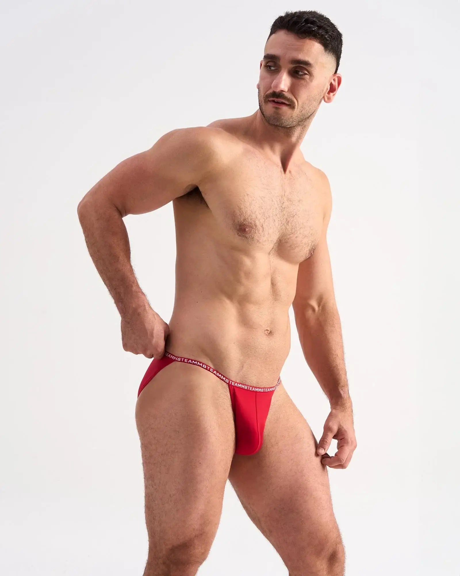 Red glide micro brief men’s briefs with thin elastic waistband and white lettering for comfortable support