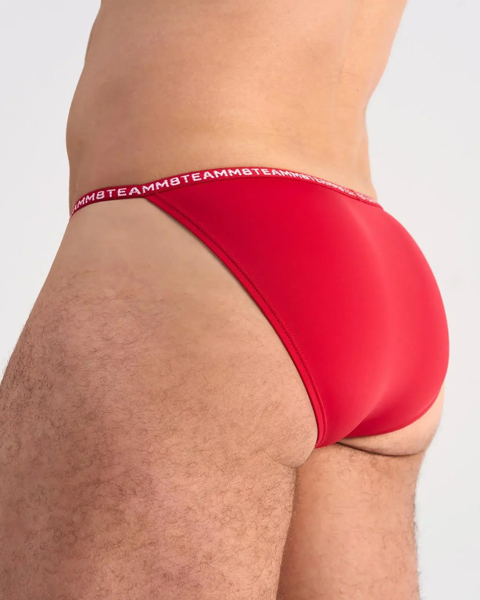 Red glide micro brief underwear featuring a red color and white teammb logo waistband for comfortable daily wear