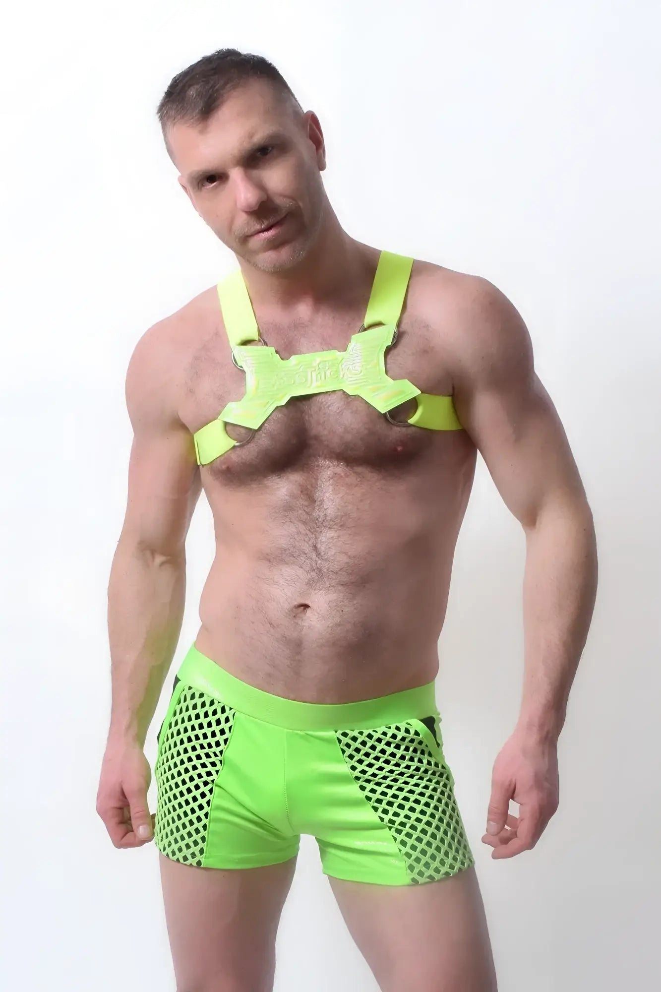 Bright neon green mesh glowtime shorts with a matching harness-style top for a bold and sporty look