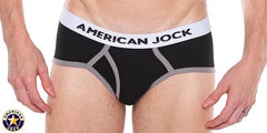 Men's black classic brief with gray trim and white waistband featuring AMERICAN JOCK logo worn by a model from the brand AMERICAN JOCK