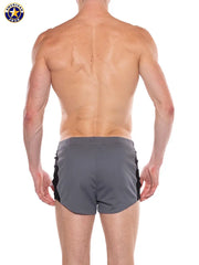 Back view of a man wearing gray and black short athletic shorts with an elastic waistband by AMERICAN JOCK