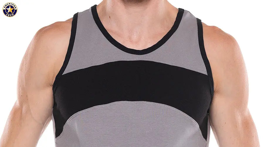 Close-up of a man wearing a sleeveless tank top with gray and black color blocks and black trim by AMERICAN JOCK