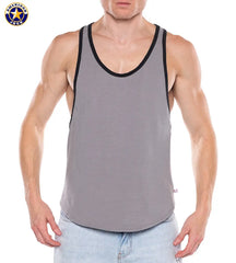 Man wearing a gray tank top with black trim and scoop neckline paired with light blue jeans by American Jock
