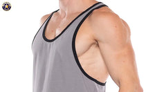 Close-up of a man wearing a platinum gray tank top with black trim around the neckline and armholes by AMERICAN JOCK