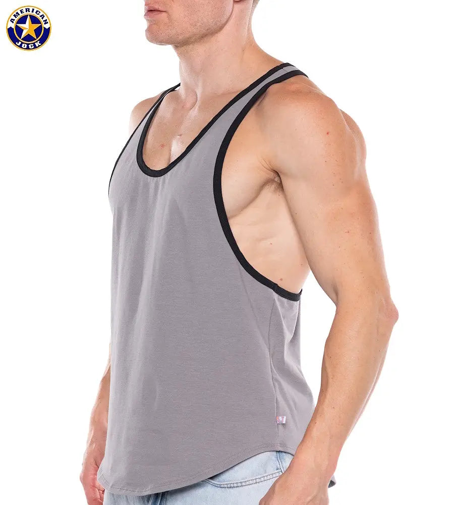 Muscular man wearing a platinum gray tank top with black trim and deep armholes by American Jock