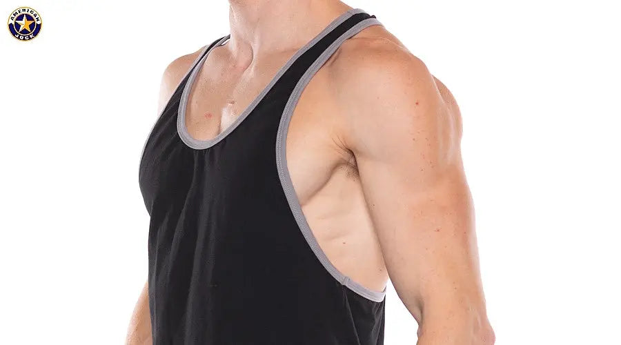 Close-up of a man wearing a black tank top with gray trim sleeveless with wide armholes by AMERICAN JOCK