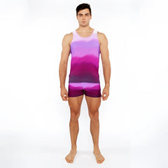 A man wearing a gradient purple and pink tie-dye tank top with matching gradient printed swim shorts