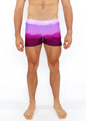 Gradient printed swim short featuring purple gradient swim trunks with a soft fade from lavender to deep violet hem