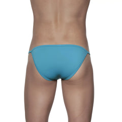 A sleek teal groovin string bikini in solid cyan blue with smooth fabric finish and brief style design