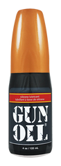 Orange-topped black bottle of gun oil silicone lubricant for firearm maintenance and protection