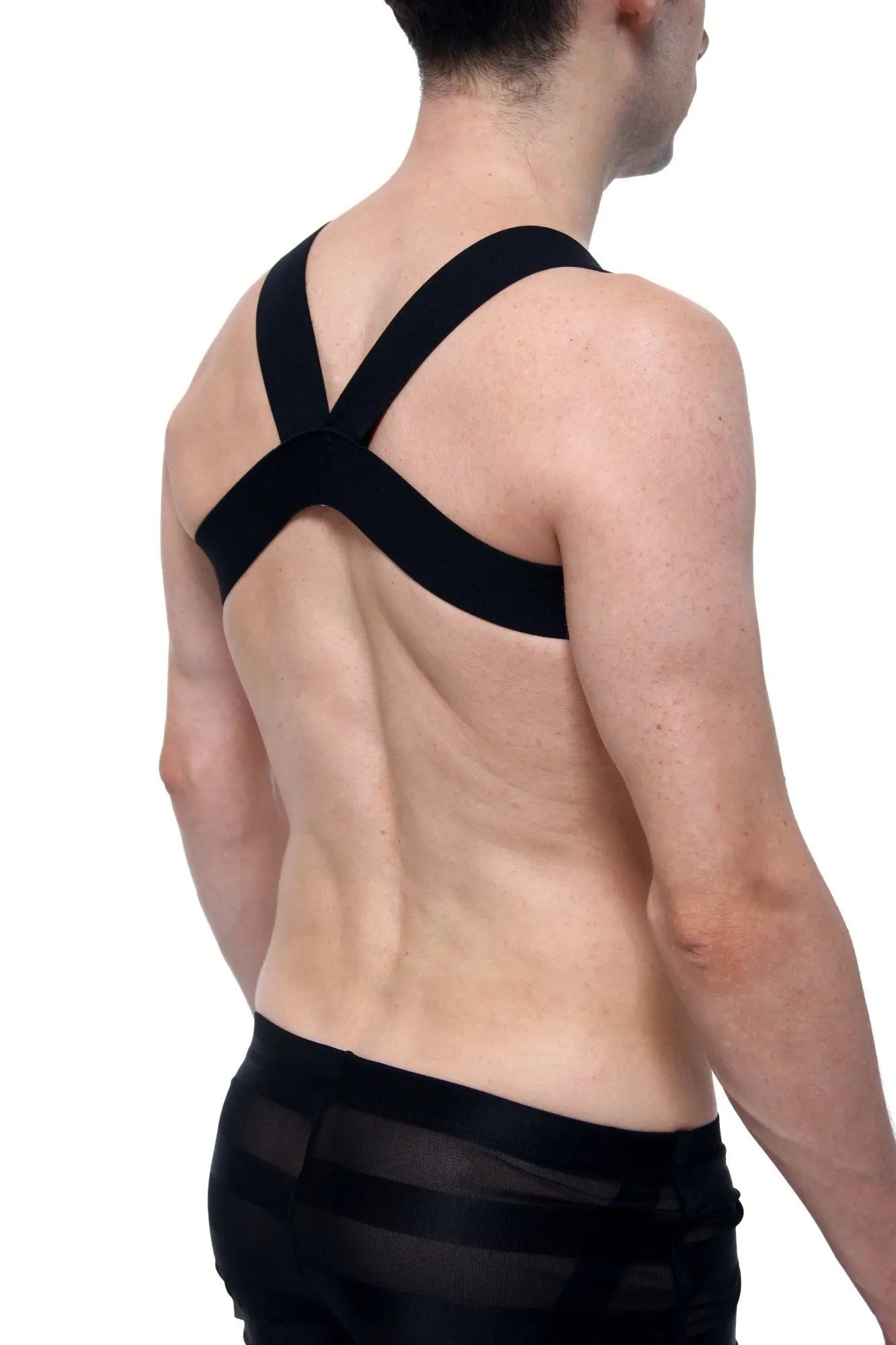 Black harness petitq givet love with cross-back support strap worn over shoulders shown from the back side