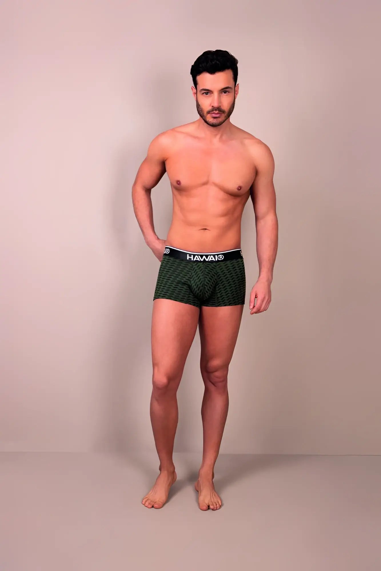 Dark green patterned hawa printed trunks with black waistband made of breathable fabric for comfortable wear
