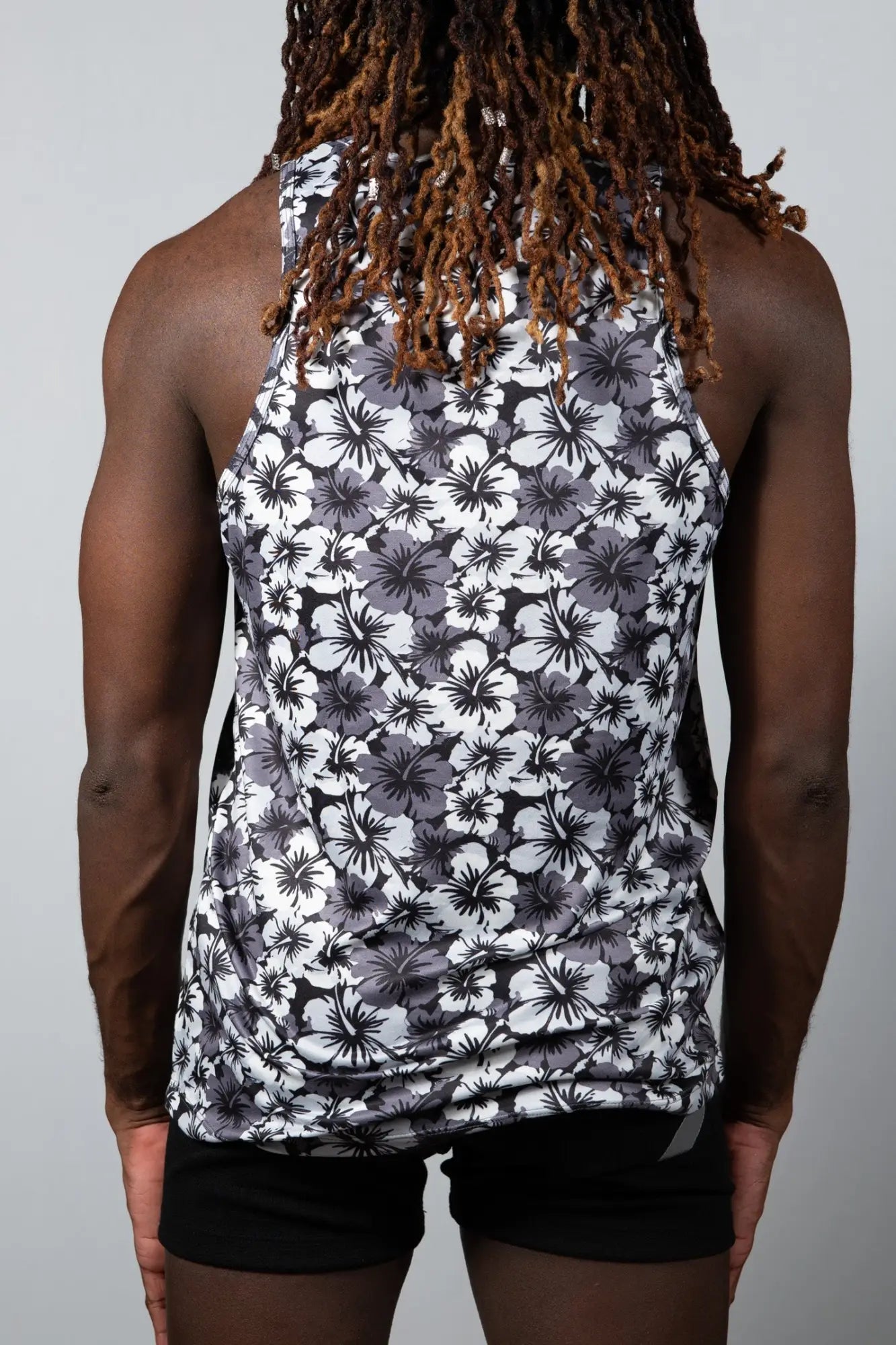 Hawaiian hibiscus print tank with black and white floral pattern fitted sleeveless design for casual wear