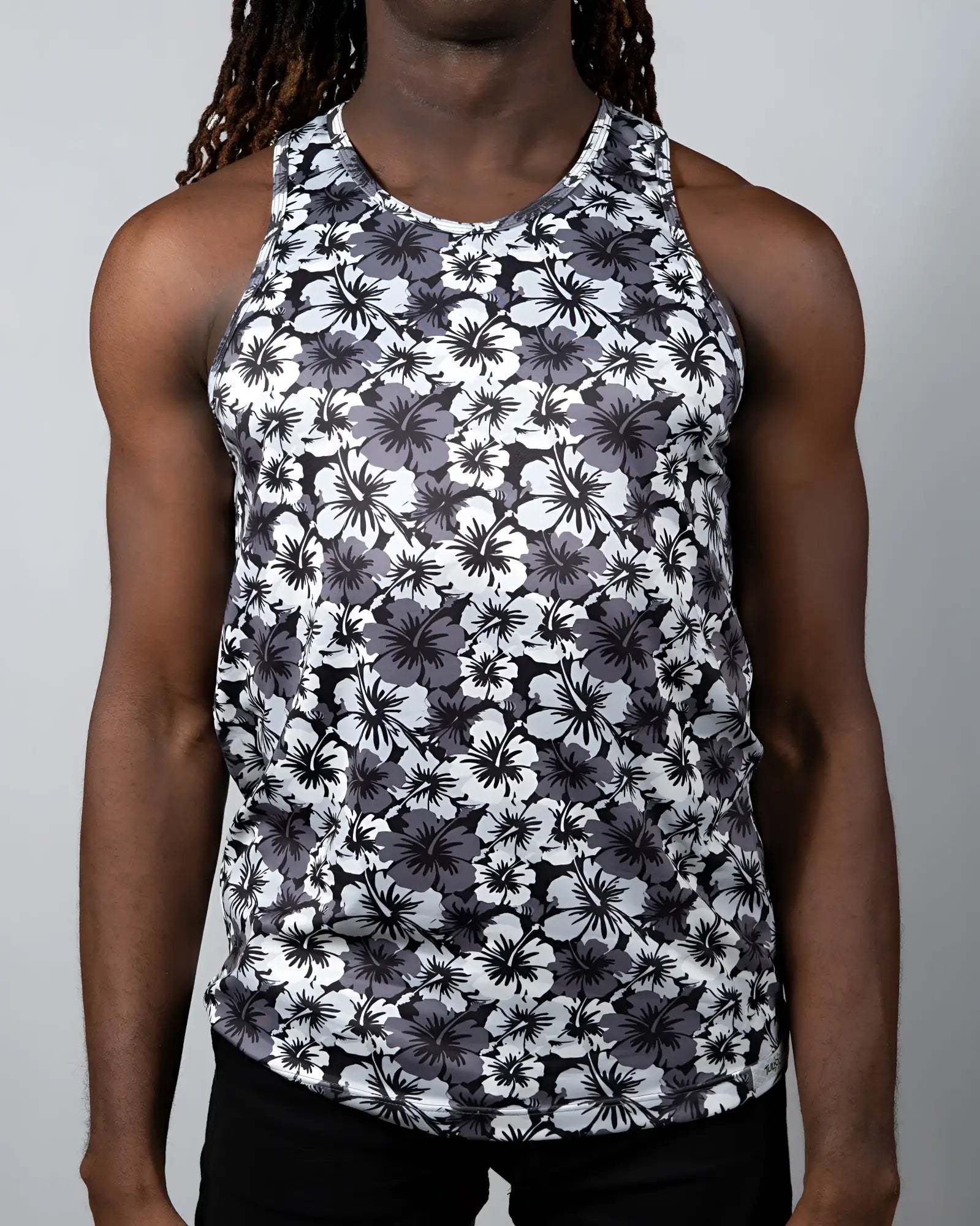 Black and white floral patterned Hawaiin hibiscus print tank top with round neckline and lightweight fabric