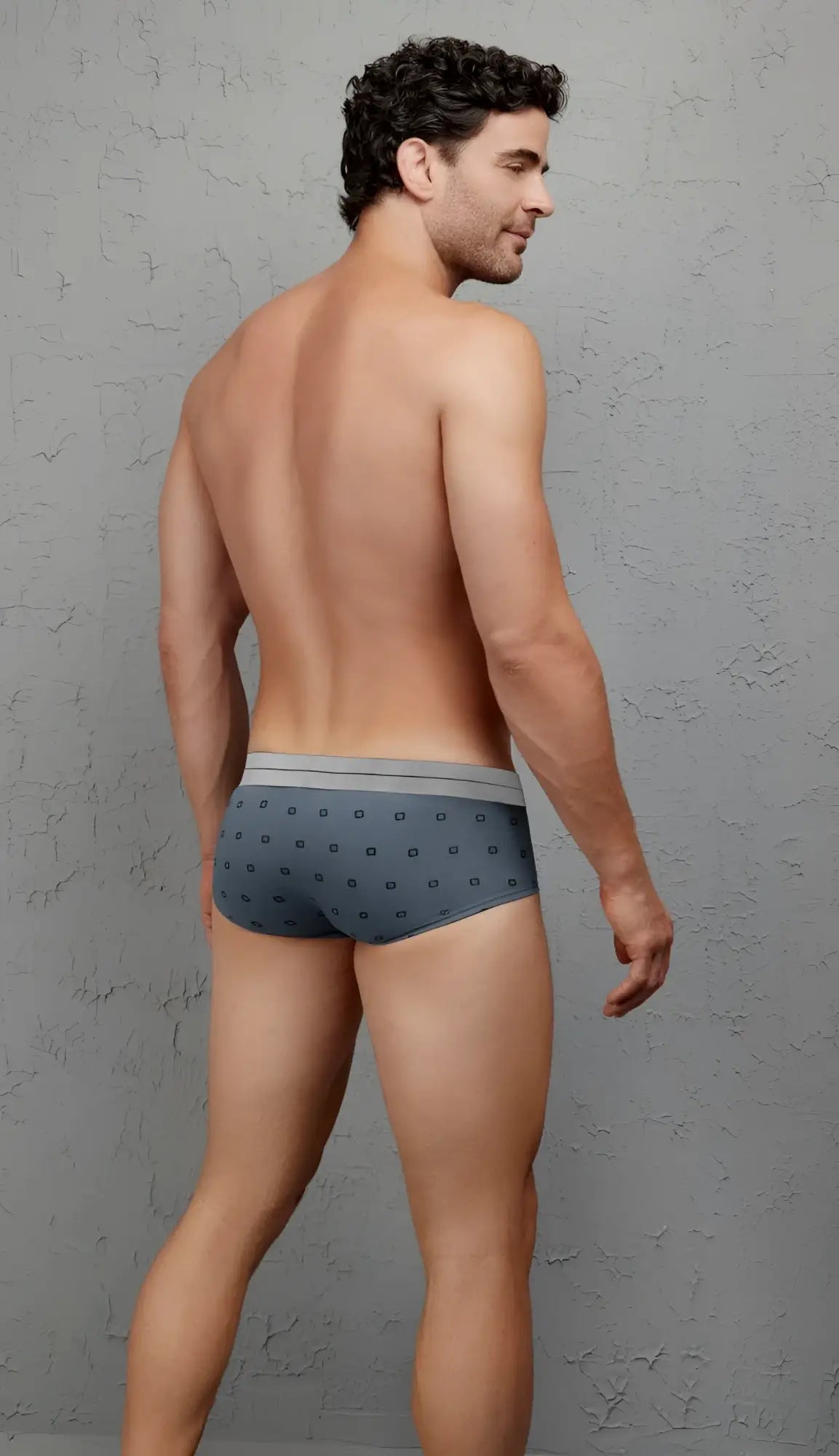 Gray patterned briefs with subtle geometric design and light gray waistband made from cotton blend fabric