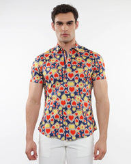 A vibrant stretch knit short-sleeved shirt with red and yellow hearts on a navy blue background