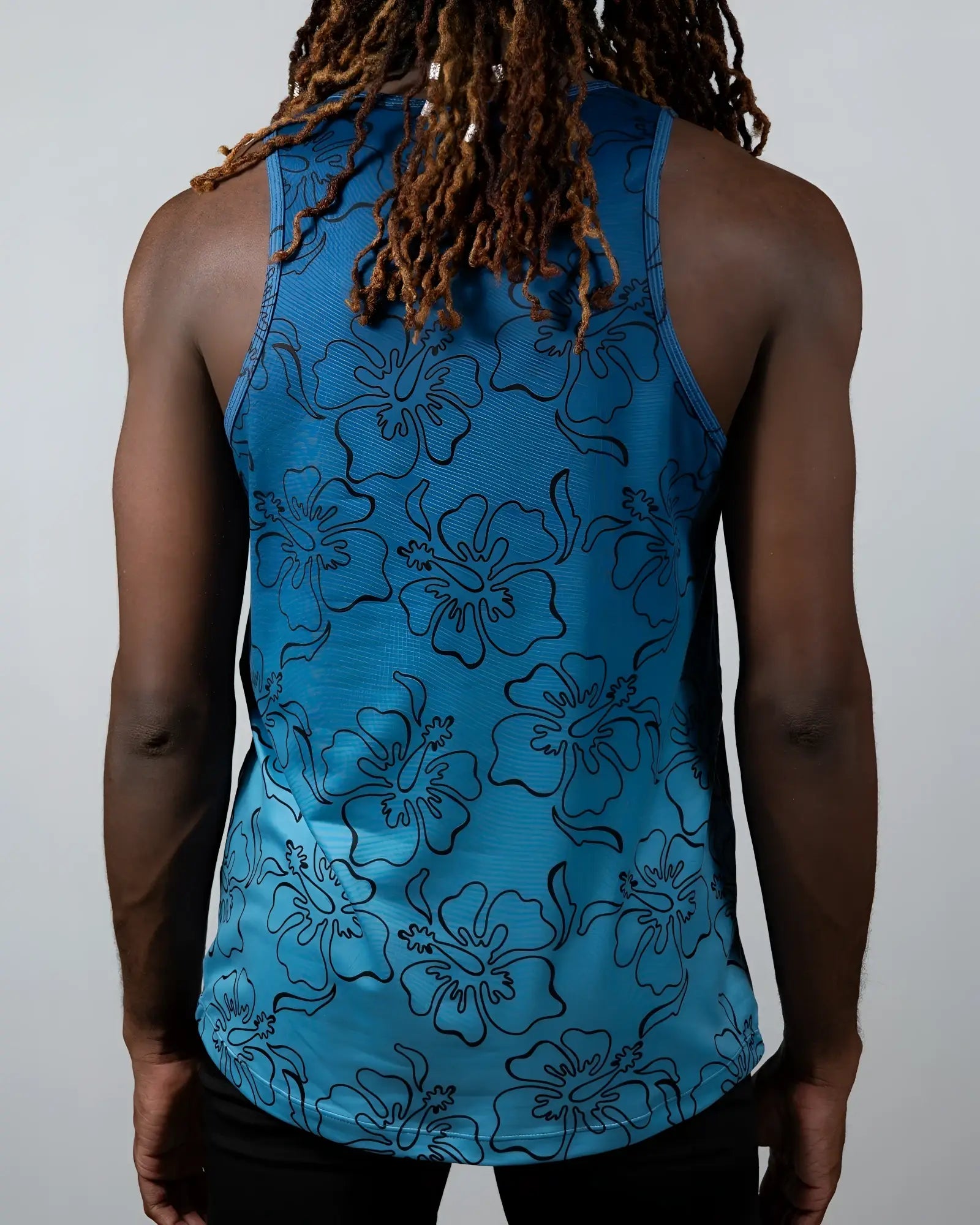Blue hibiscus ombre print tank top featuring black outlined floral pattern perfect for casual summer wear