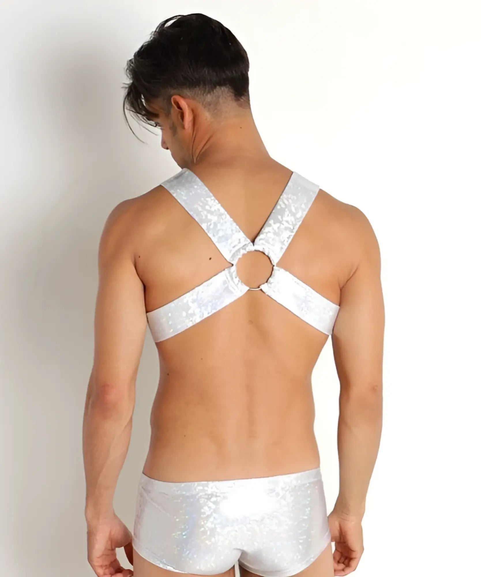 Silver sequined hologram harness top with central circular ring and matching shiny briefs for statement wear