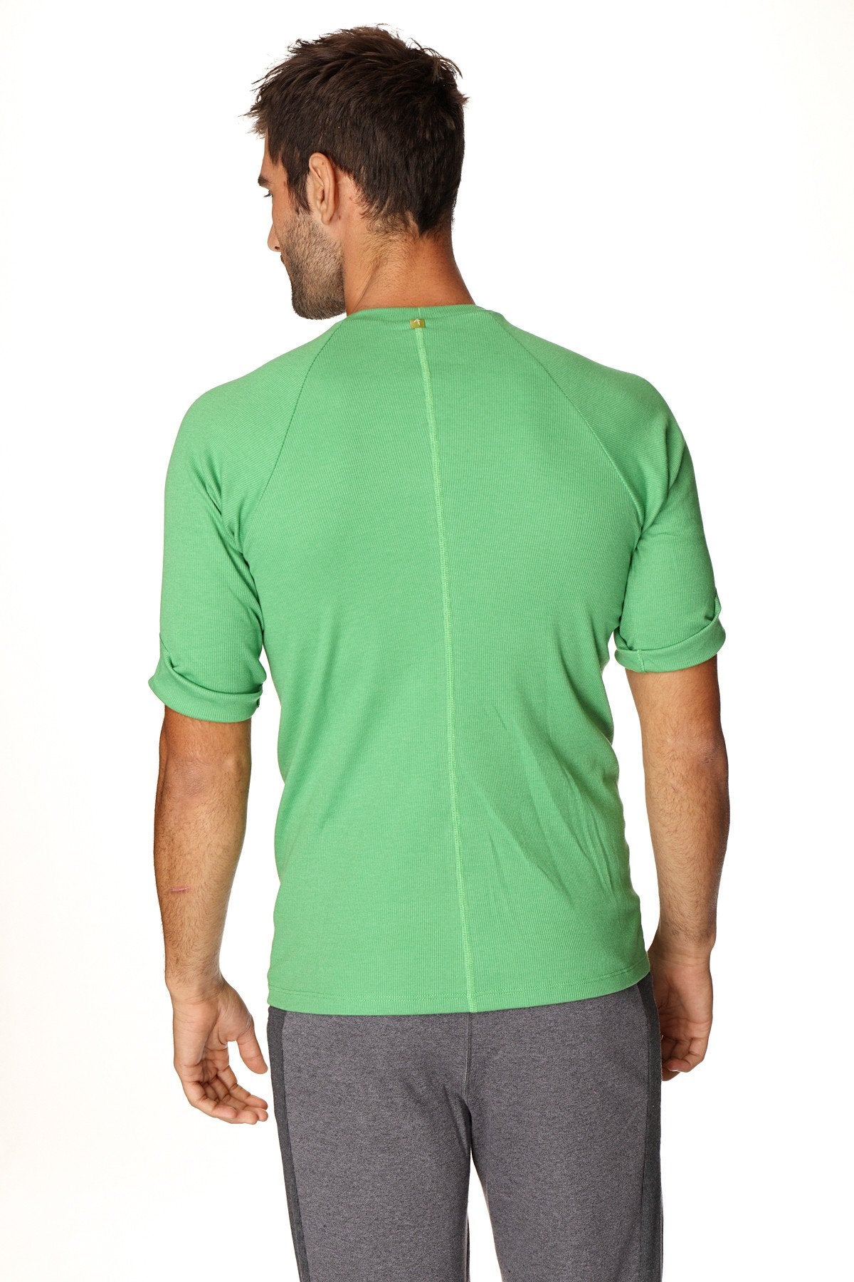 A vibrant green hybrid crew neck raglan tee with short sleeves, bamboo fabric, subtle ribbed texture, and rolled cuffs