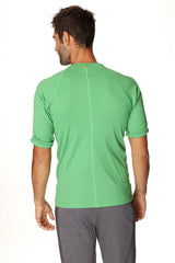A vibrant green hybrid crew neck raglan tee with short sleeves, bamboo fabric, subtle ribbed texture, and rolled cuffs