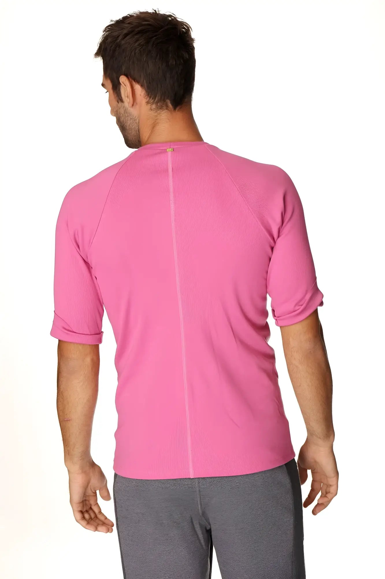 A vibrant berry pink hybrid crew neck raglan tee with textured fabric and short sleeves for athletic wear