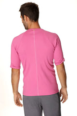 A vibrant berry pink hybrid crew neck raglan tee with textured fabric and short sleeves for athletic wear