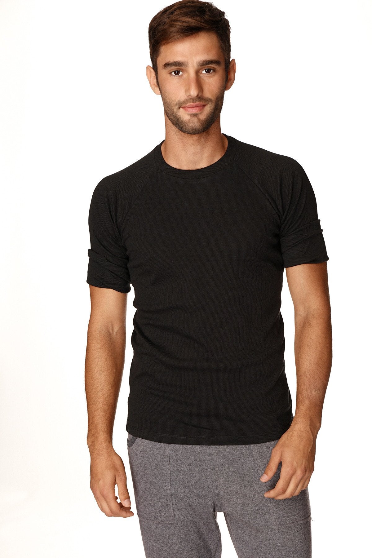 Black hybrid crew neck raglan tee with short rolled-up sleeves made of soft breathable fabric