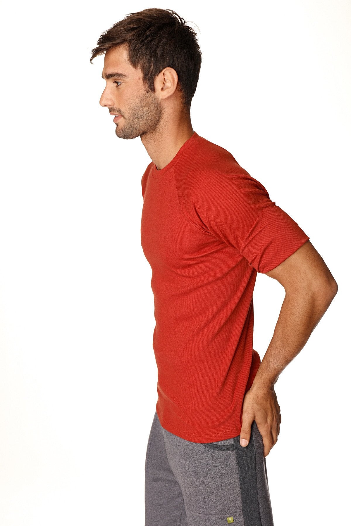 Hybrid crew neck raglan tee in cinnabar red with short sleeves and subtle texture for athletic wear