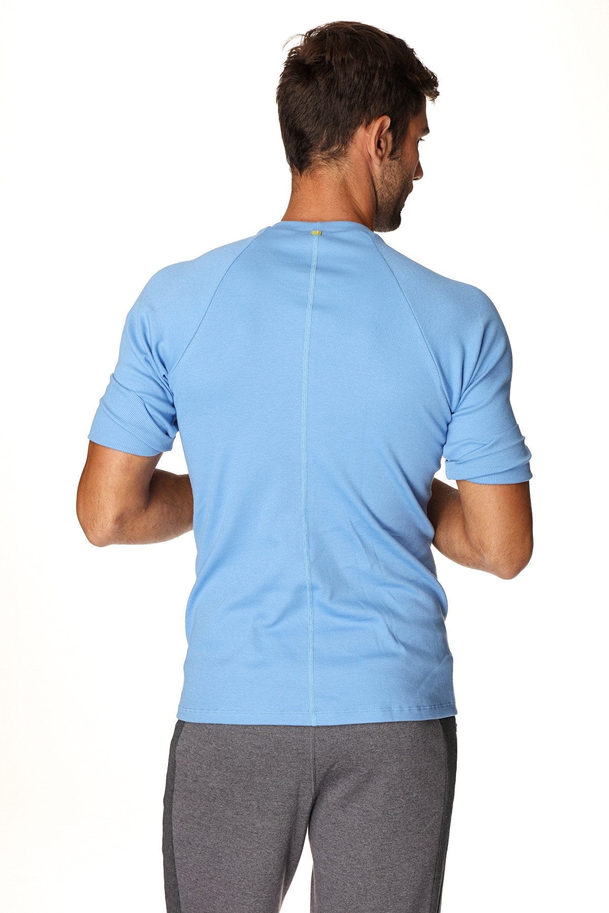 Light blue hybrid crew neck raglan tee with short sleeves and a subtle vertical seam on the back side