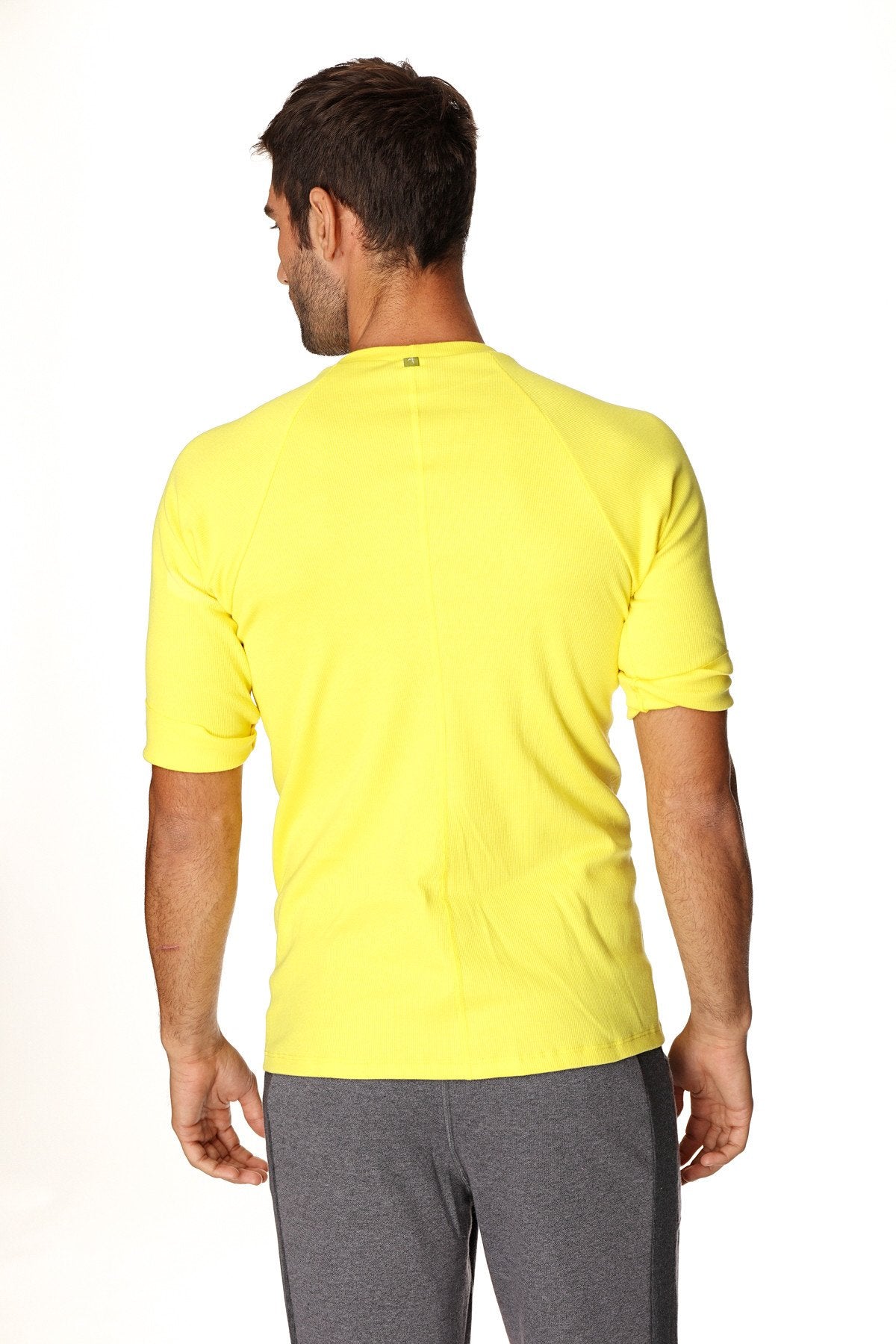 Bright yellow hybrid crew neck raglan tee with short sleeves designed for athletic performance and comfort