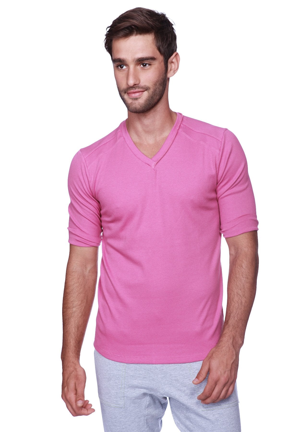 A vibrant pink hybrid v-neck short-sleeved shirt made of smooth lightweight fabric for casual wear