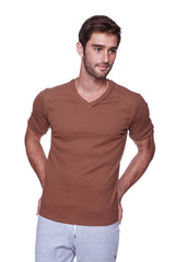 A man wearing a chocolate brown hybrid v-neck short-sleeved t-shirt made from soft breathable material