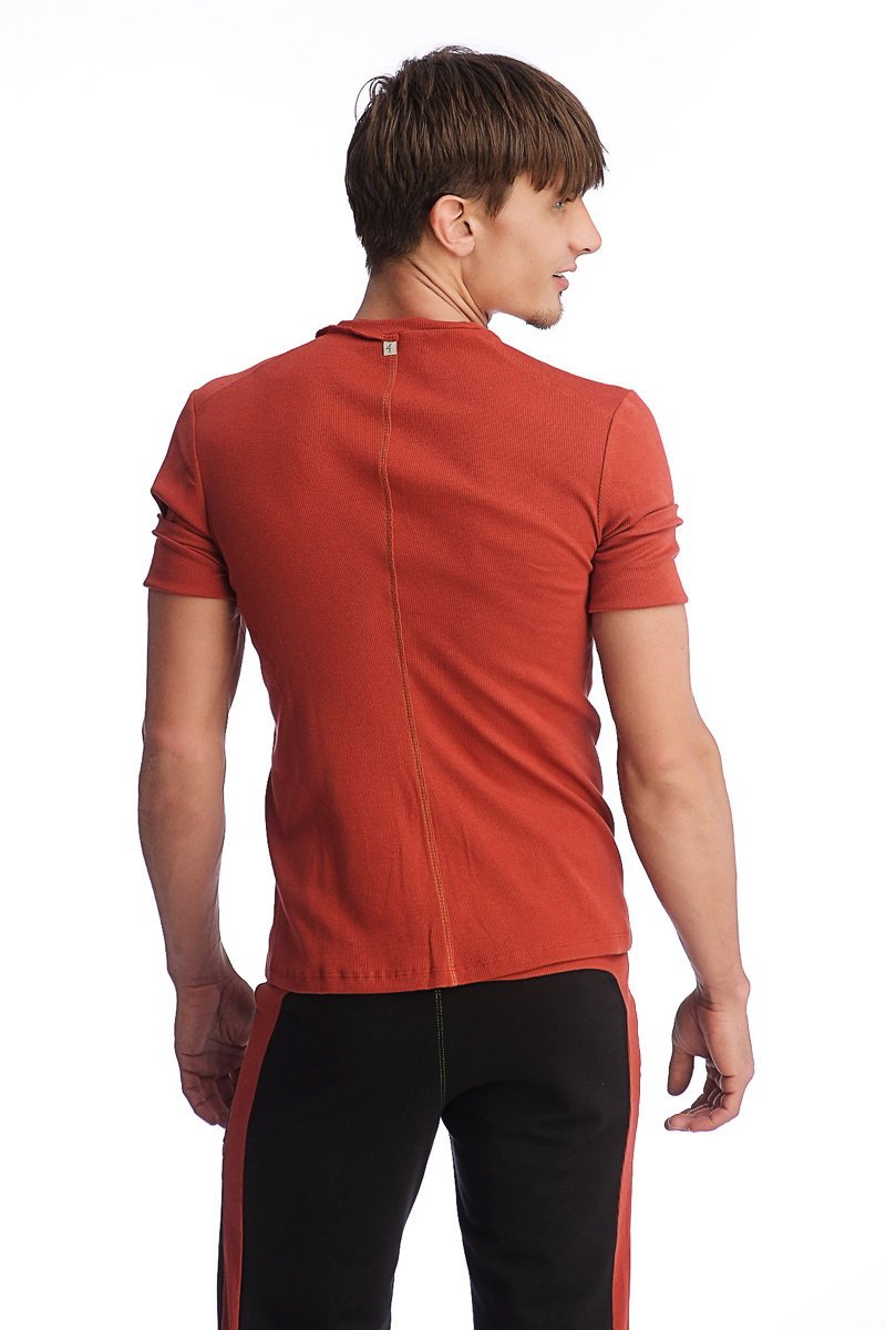 A rust-orange hybrid v-neck short-sleeved t-shirt showing the back with a subtle vertical seam detail