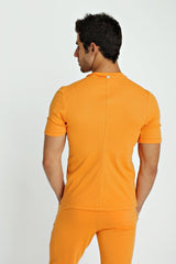 Orange short-sleeved fitted hybrid v-neck t-shirt with central back seam and subtle neckline brand tag shown from back