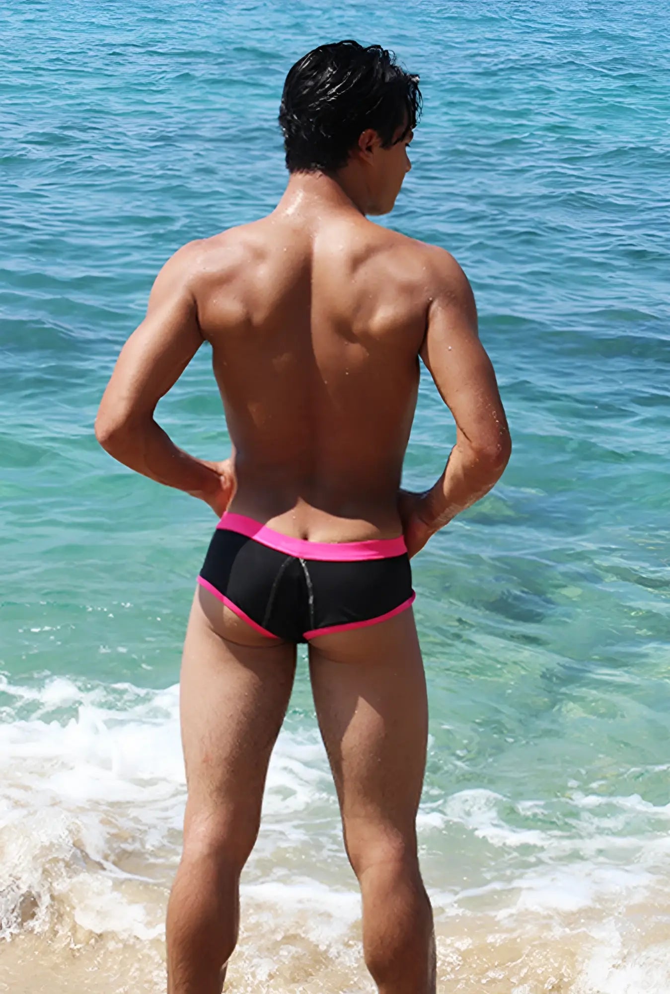 Black swim trunks with bright fuchsia contrast trim and stitching from icker sea cheeky bikini swimwear collection