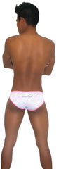 Back of white swim trunks with pink trim subtle pattern and moroccan brand embroidery in pink white icker sea devoured slip bikini underwear