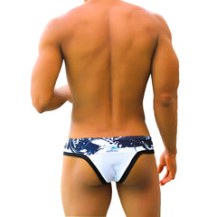 Icker sea graffiti macro contrast trim thong swimwear in white and black with a white and navy blue patterned design