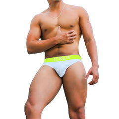 Light blue athletic briefs with neon green waistband featuring icker logo from sea kiss my ass brief underwear green coi-21-04