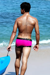 Bright pink Icker Sea lace up square cut swim trunks with a black patterned waistband for swimwear use